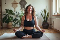 A happy chubby woman do yoga at home exercise sports adult.