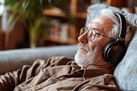 Senior man with headphones listen to music electronics accessories accessory.