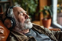 Senior man with headphones listen to music photo electronics photography.