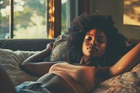 Young african american woman relax on the sofa at home person tattoo human.