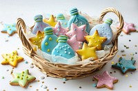 A basket with baby bottle cookies and star cookies dessert food representation.