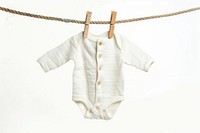 Newborn babysuit hang on rope with clothespin white background coathanger outerwear.