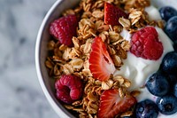 A bowl of almond buckwheat granola with yogurt and berries berry food strawberry.