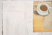 Adhesive tape is stuck on a coffee ephemera collage backgrounds paper white.