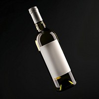 Wine bottle with white label glass drink black background.