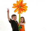 2 kid rising one hand portrait flower holding.