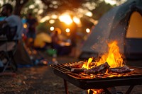 People party camping with BBQ grilling meat bbq outdoors cooking.