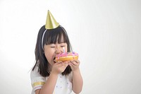 Asia girl eatting donut portrait birthday eating.