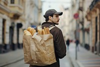 Delivery man delivering food shopping adult bag.