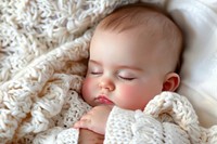 Sleeping baby portrait newborn blanket.