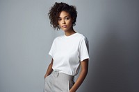 Black female wearing white trousers and top photo photography clothing.