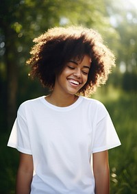 Black woman wearing white over size t-shhirt happy laughing clothing.