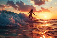 Woman in swimsuite are surfing on wave outdoors recreation nature.