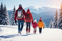 Family enjoying skiing outdoors walking holiday.