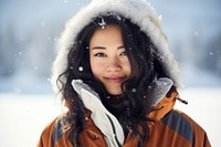 Asian american woman portrait snow outdoors.