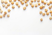 Cute shape-biscuit confetti border popcorn snack food.