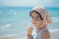 Middle eastern little girl cream beachwear clothing.