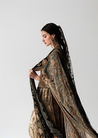 Holding a bronze paper sheet dress gown clothing.