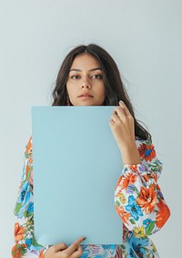 Holding a blue paper sheet photography woman portrait.