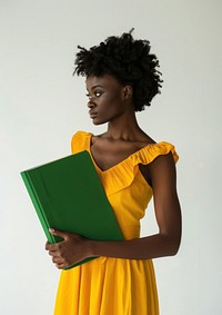 Holding a green paper sheet photography portrait reading.