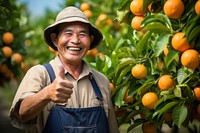 Thai farmer orange clothing laughing.
