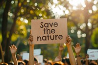 Environmentalist holding save the nature sign