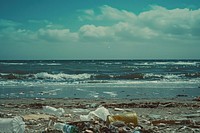 Waste trash on the beach outdoors horizon garbage.