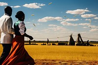 Photo of a African Wedding outdoors windmill walking.