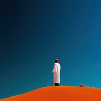 Photo of a Arab outdoors standing walking.