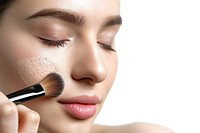 Photo of closeup woman face brush cosmetics device.