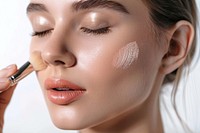Photo of closeup woman face brush cosmetics female.