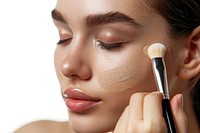 Photo of closeup woman face brush cosmetics device.