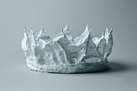Crown in style of crumpled paper porcelain outdoors.