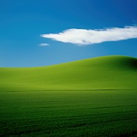 Photo of green field landscape grassland outdoors.