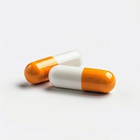 Two orange and white pill capsule medication.