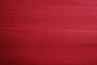 Top view photo of a plain fabric texture maroon velvet home decor.