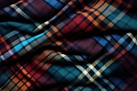Top view photo of a plaid patterns clothing knitwear blanket.