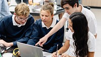 Diverse group of students collaborate in science lab. Diverse students, teamwork, and learning in school classroom. Diverse students collaborate in science class, teamwork group project at school