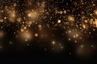 Shimmering golden particles background shimmer light.