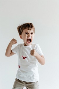 An angry kid yell and throwing fist child white face.