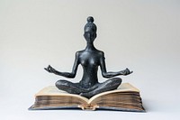 Mindfulness coach book meditation sculpture.