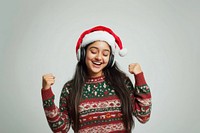 Joyful woman sweater headphones christmas.