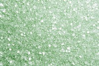 Pale light green glitter background texture granulated crystals culinary.