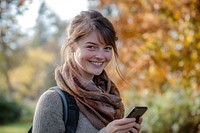 Woman looking at the phone happy smile background.