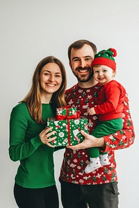 Family holding christmas gifts celebration festival together.