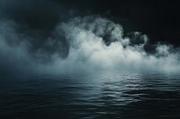 Mysterious fog over dark water.