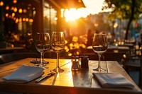 Restaurant with empty wooden tables outdoors romantic evening.