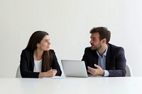 Businesswoman in her 20s and businessmen in his 40s pleasant working with laptop on the table conversation collaboration professional.