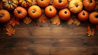 Autumn pumpkins on wooden background.