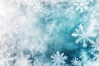 A white snowflakes background winter blue atmosphere.